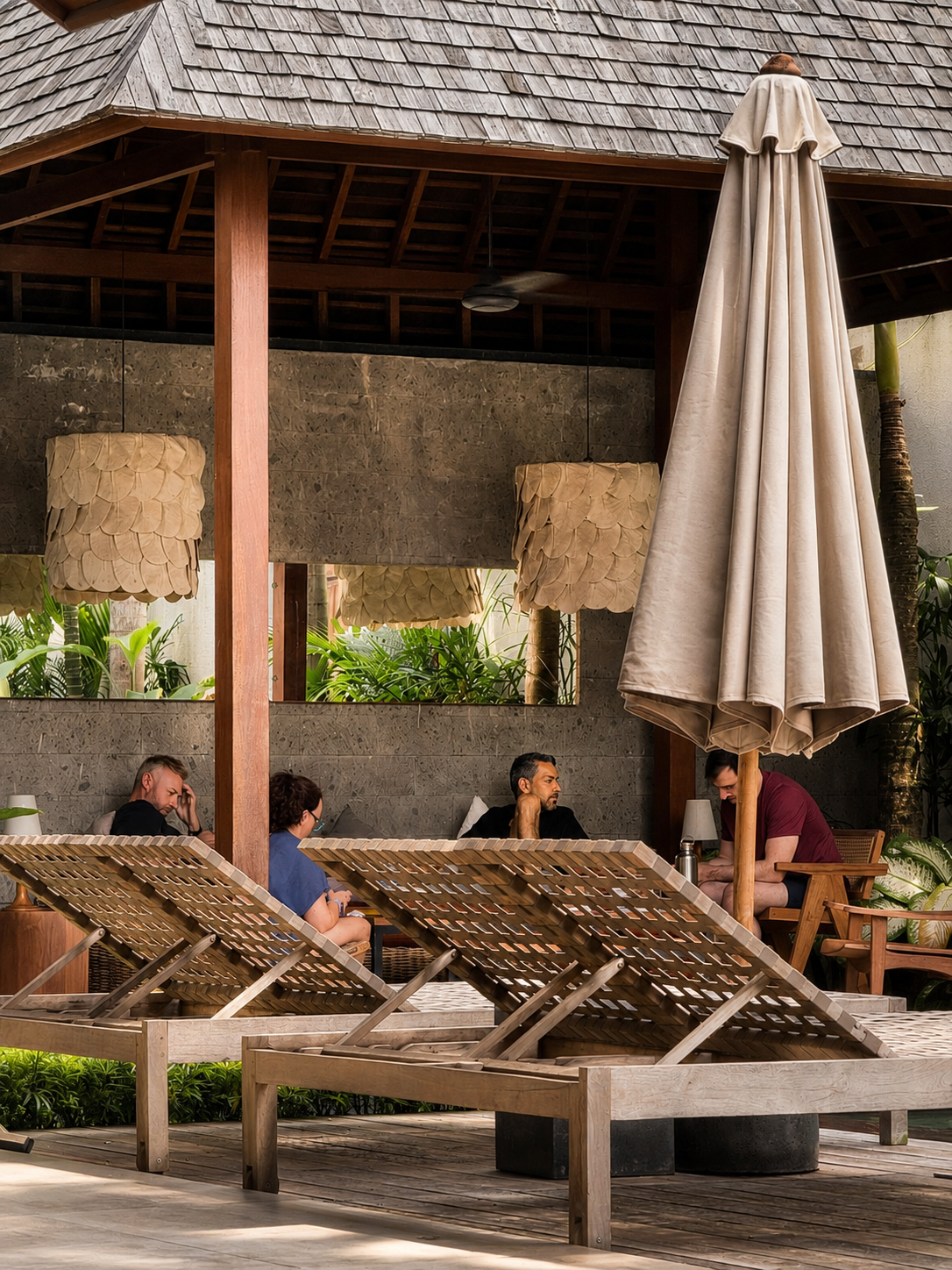 Quiet conversations unfolding near the loungers and recovery area